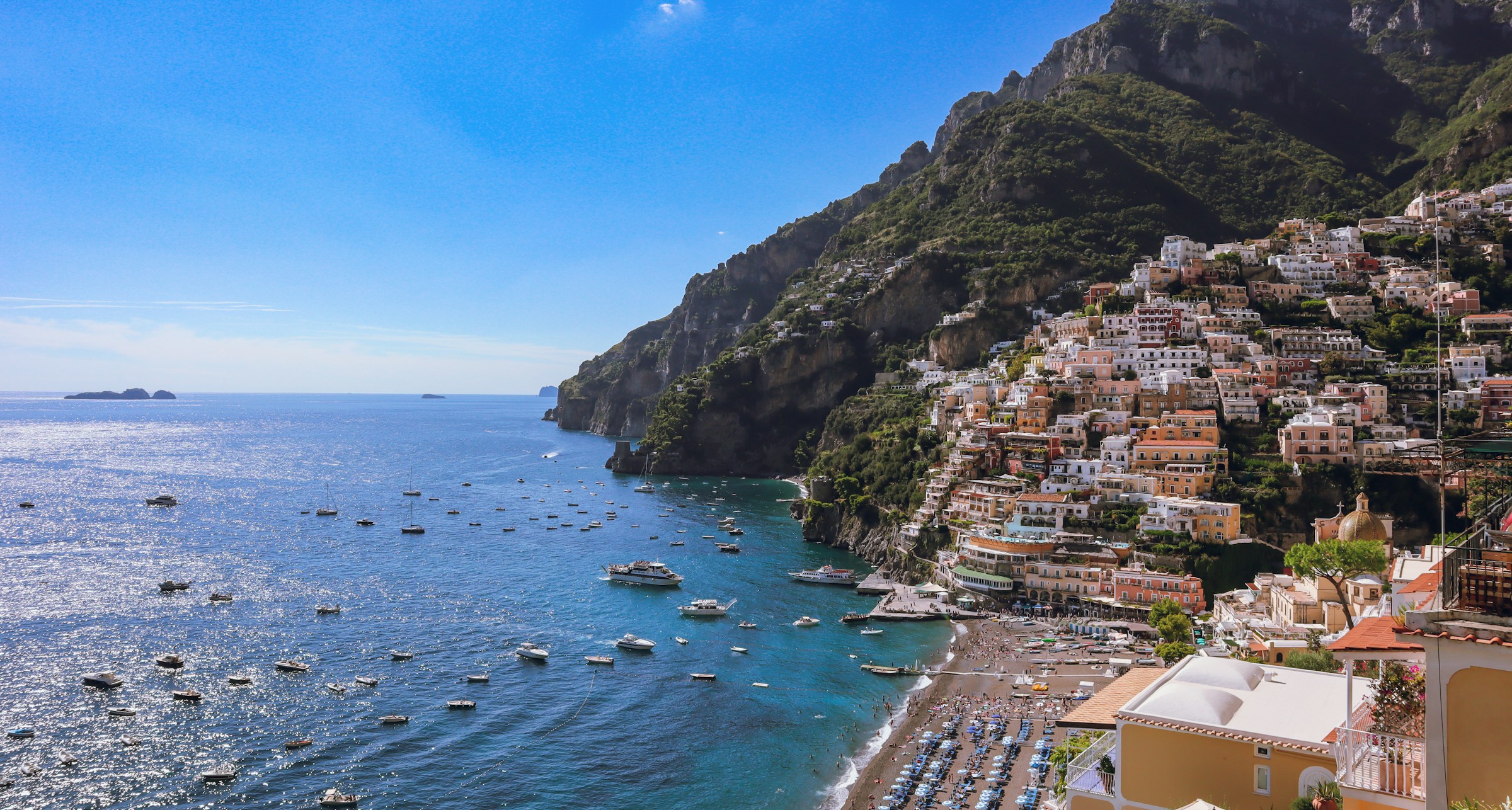 Colourful Positano buildings above the blue Mediterranean Sea